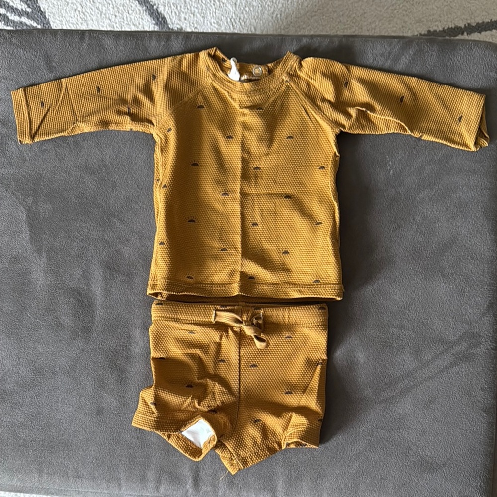 Quincy Mae Newborn swimsuit, material is spf 50
